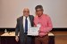 Dr. Nagib Callaos, General Chair, giving Dr. Julio C. Tafur the best paper award certificate of the session "Communication and Control Systems, Technologies and Applications." The title of the awarded paper is "Active Noise Control Proposal for Rotating Machines."